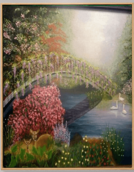 Painted garden bridge over a still pond, banked with pink blossom