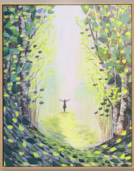Figure walking a woodland path into a shaft of light