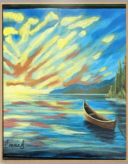 Wooden boat drawn up on a lake at sunset